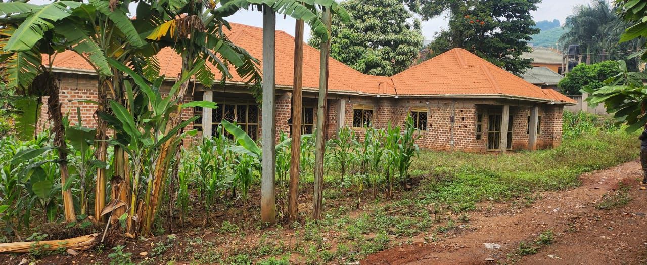 Land with Rentals for Sale in Bwebajja, Entebbe Road, Uganda